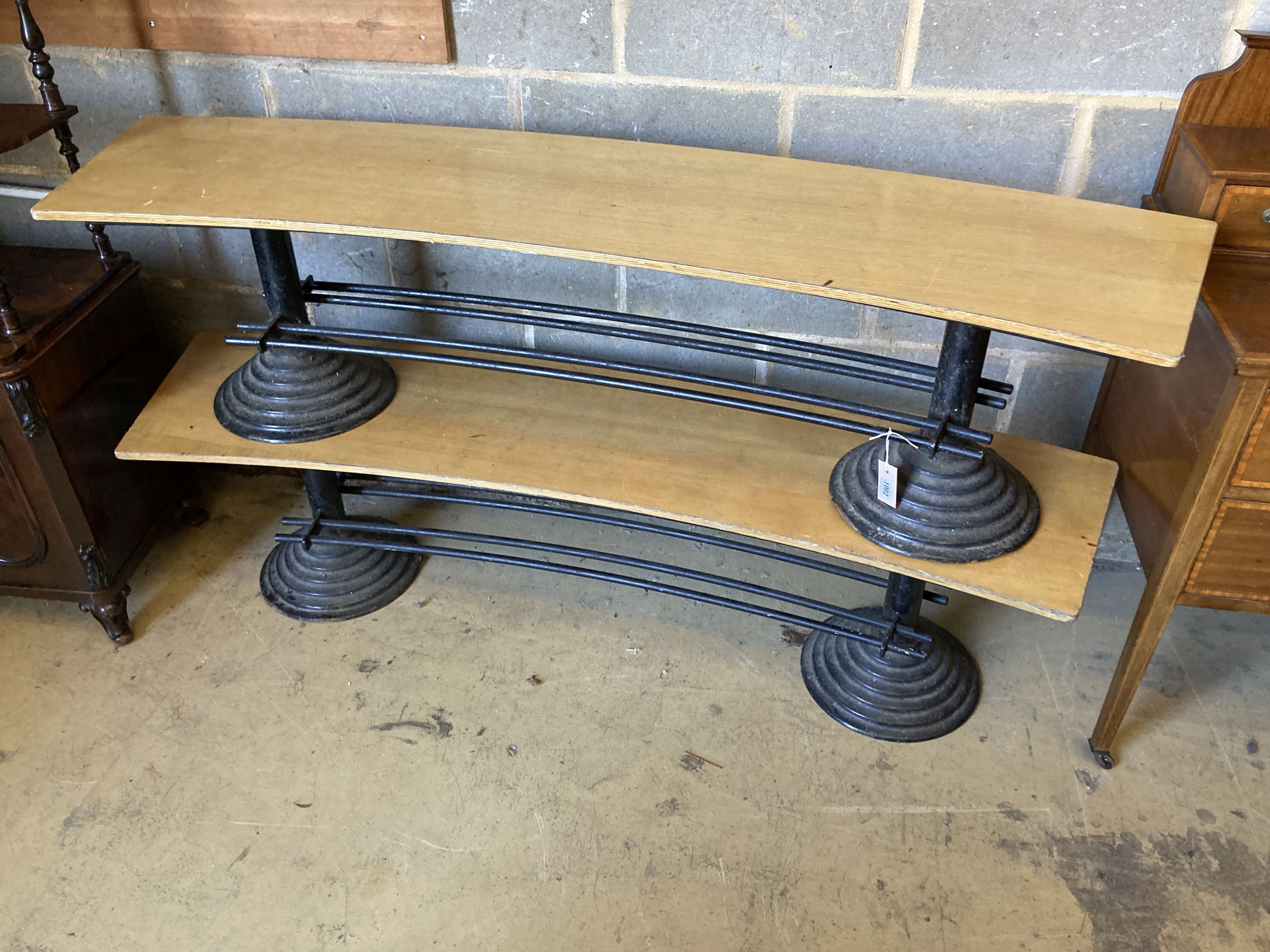 A pair of oak and cast iron curved benches, length 170cm, depth 40cm, height 43cm